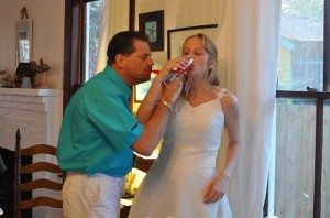 The groom shares the first bite of wedding cake with his bride.