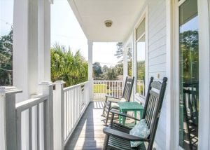 rocking chairs at paula deen's y'all come inn tybee island ga mermaid cottages