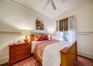 a queen bedroom at a wave call cottage