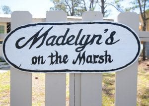 we love the hand painted sign at madelyn's on the marsh cottage