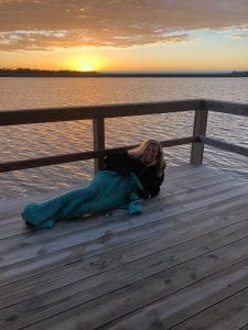 the midwest mermaid back river sunset