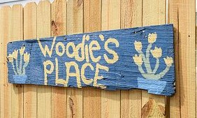 woodie's place sign